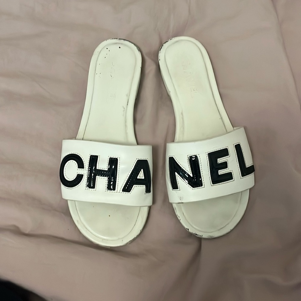 CHANEL White Slides with Black Lettering